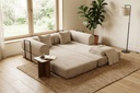 Sofá cama comprimido Curx tejido pana color beige — ambiente de salón junto a una ventana